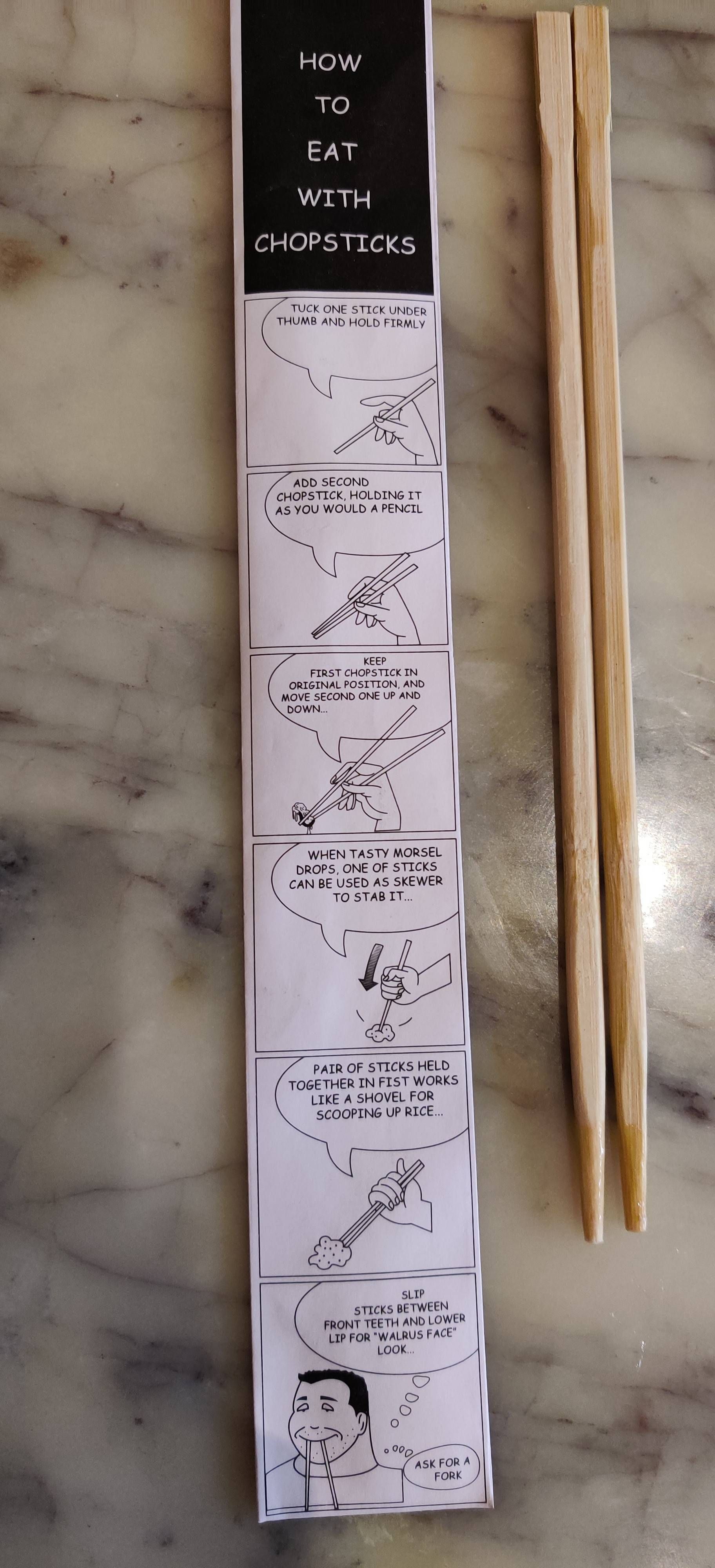 Local asian restaurant has instructions on how to use chopsticks, including what to do if you can't