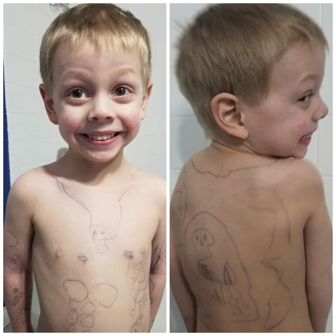 My 5 year old apparently let his brother draw tattoos all over him... oh and those circles on his right ribcage are abs I am told.