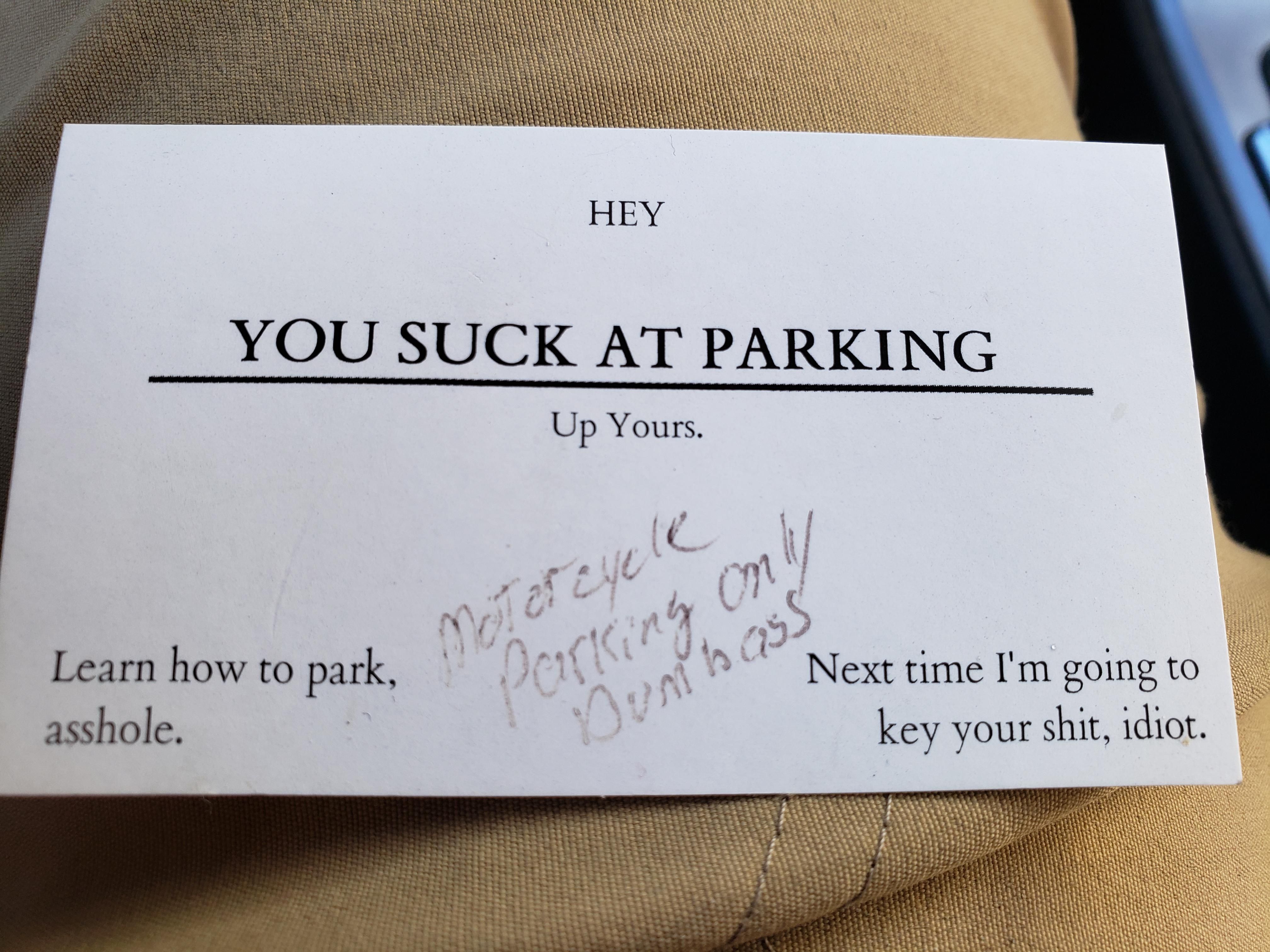 Business card my wife got after "accidentally" parking in motorcycle only parking spot. At least I got a hearty laugh.