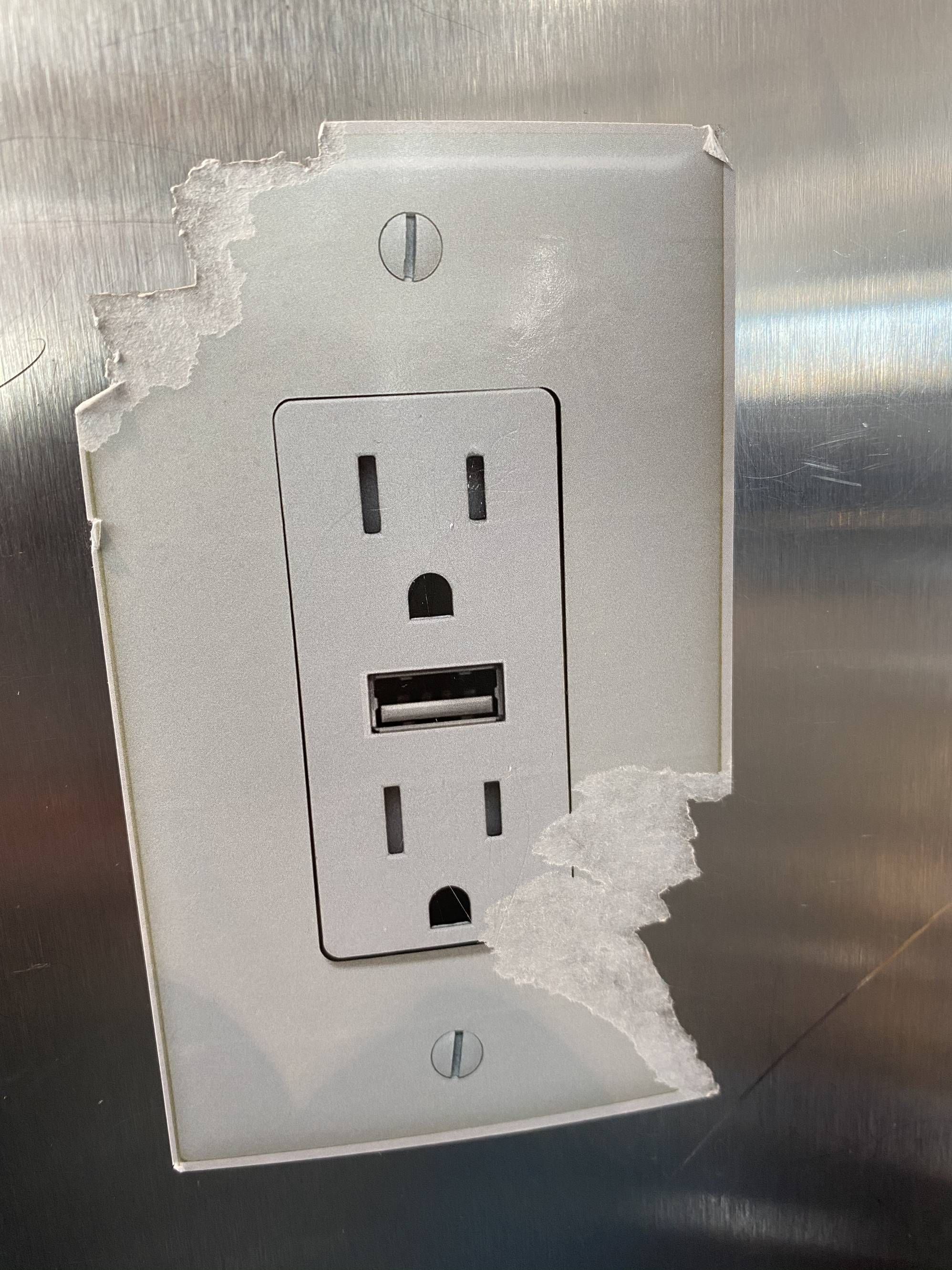 Someone put a sticker of a outlet/USB charger on one of the posts at the Denver International Airport. Someone didn’t find it funny.