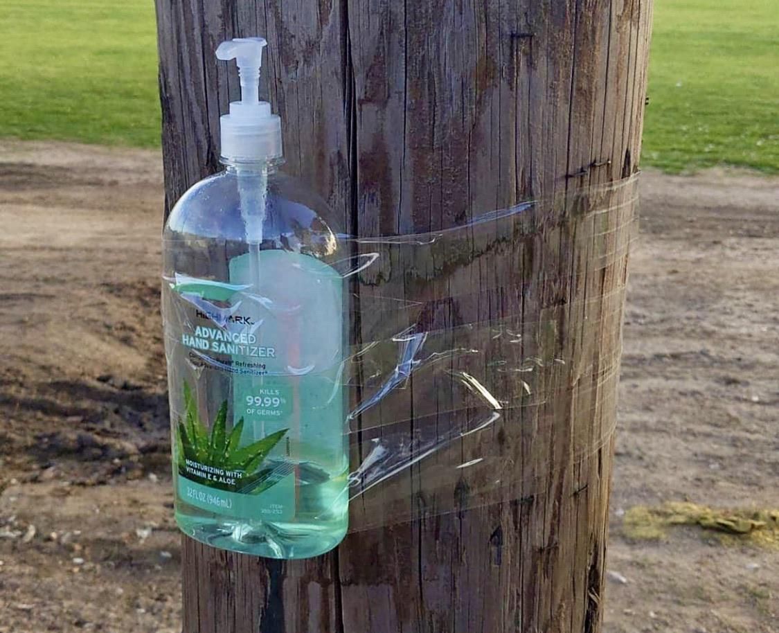 Someone placing random hand sanitizer station around in public places.
