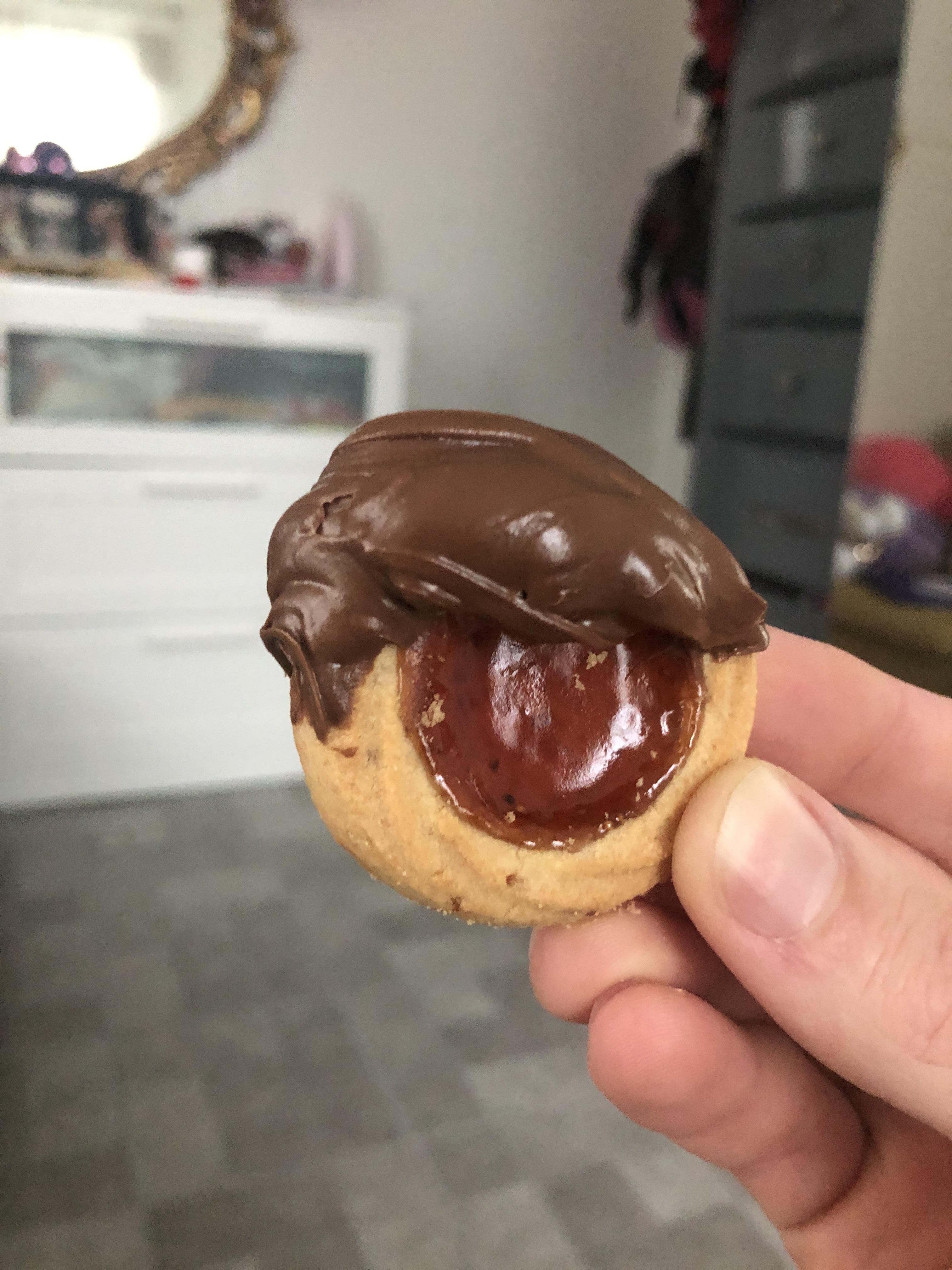 Dipped this cookie in Nutella, accidentally gave it the news anchor haircut.