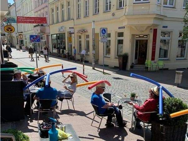 This cafe in Germany provides its guests with social distancing pool noodle heads