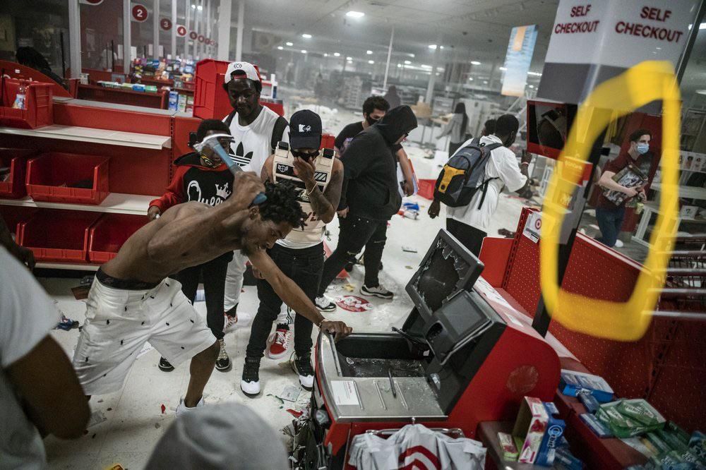 Is the white dude on the right looting LEGOs?