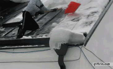 Snow pushes man off the roof