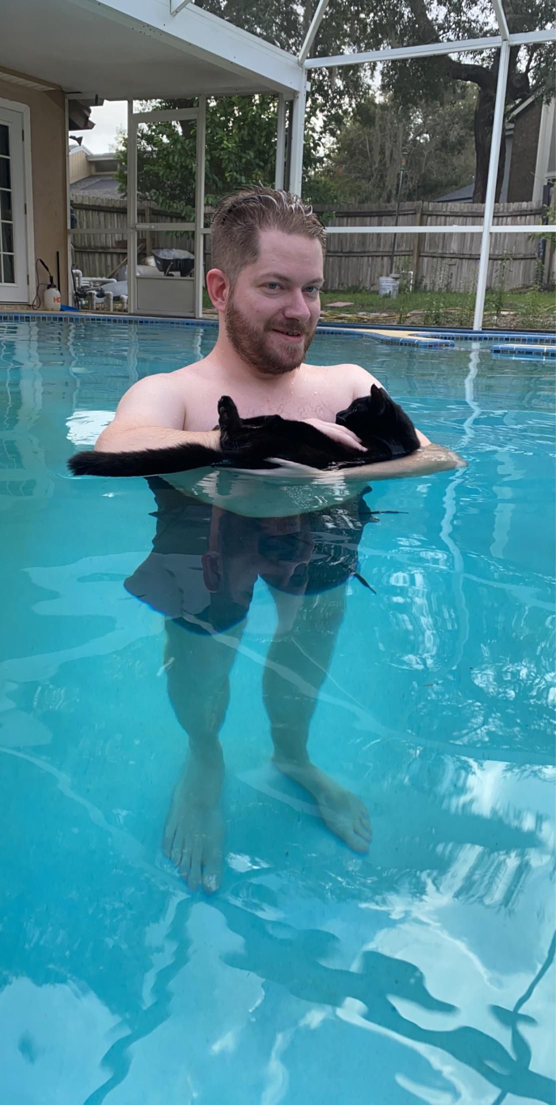 My boyfriend thought it would be funny to bring our cat into the pool. This picture is the result. Please enjoy.