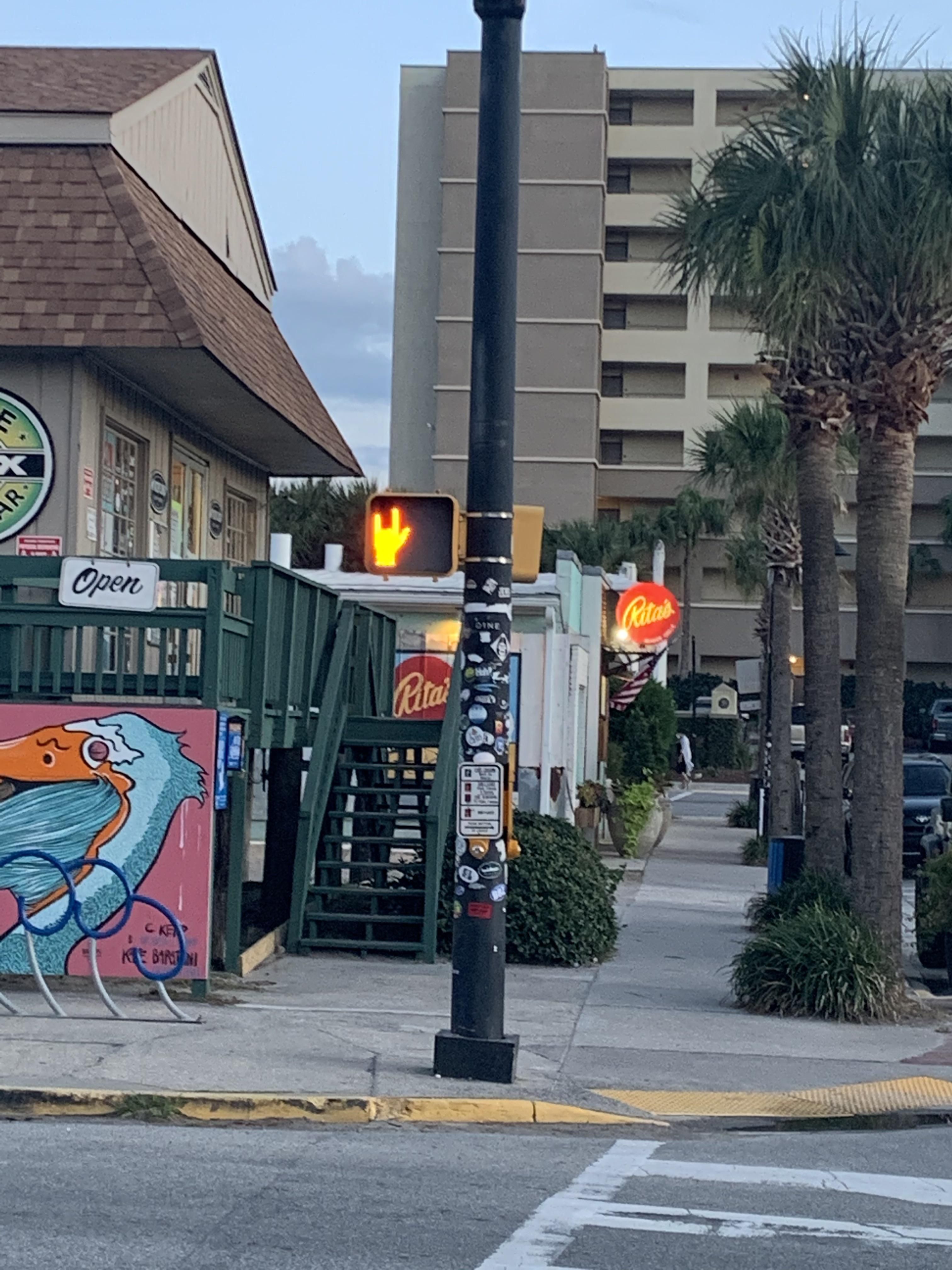 This pedestrian light in Folly Beach. I assume it’s broken because all of the others around it have five fingers.