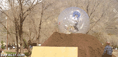 Plastic ball giving birth to a biker