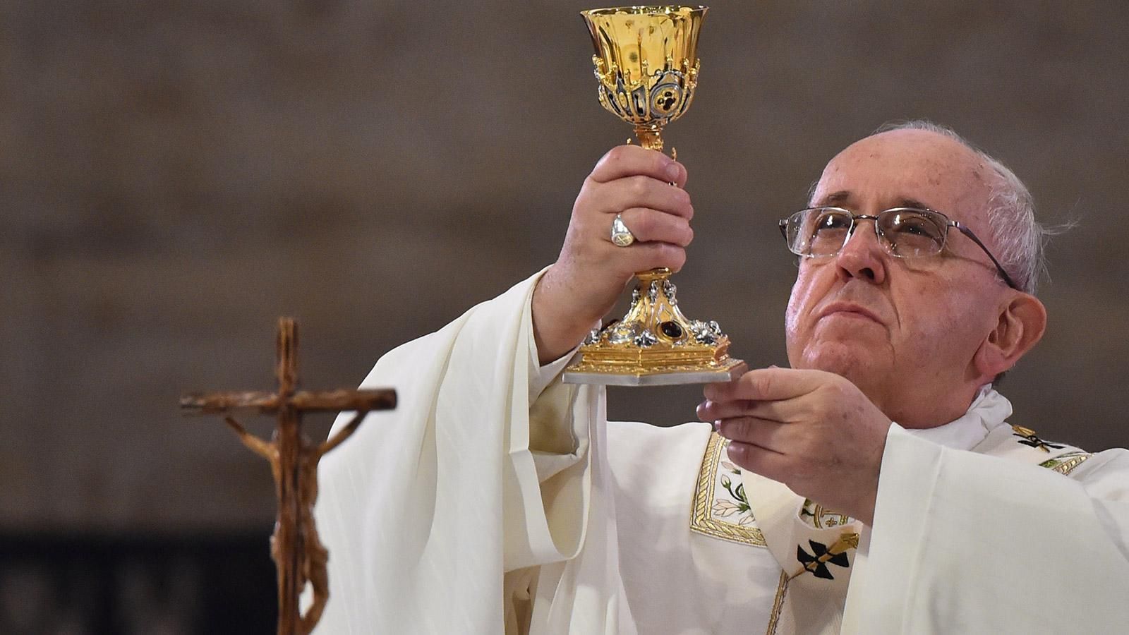 Pope Francis checking if the wine is gay before blessing it
