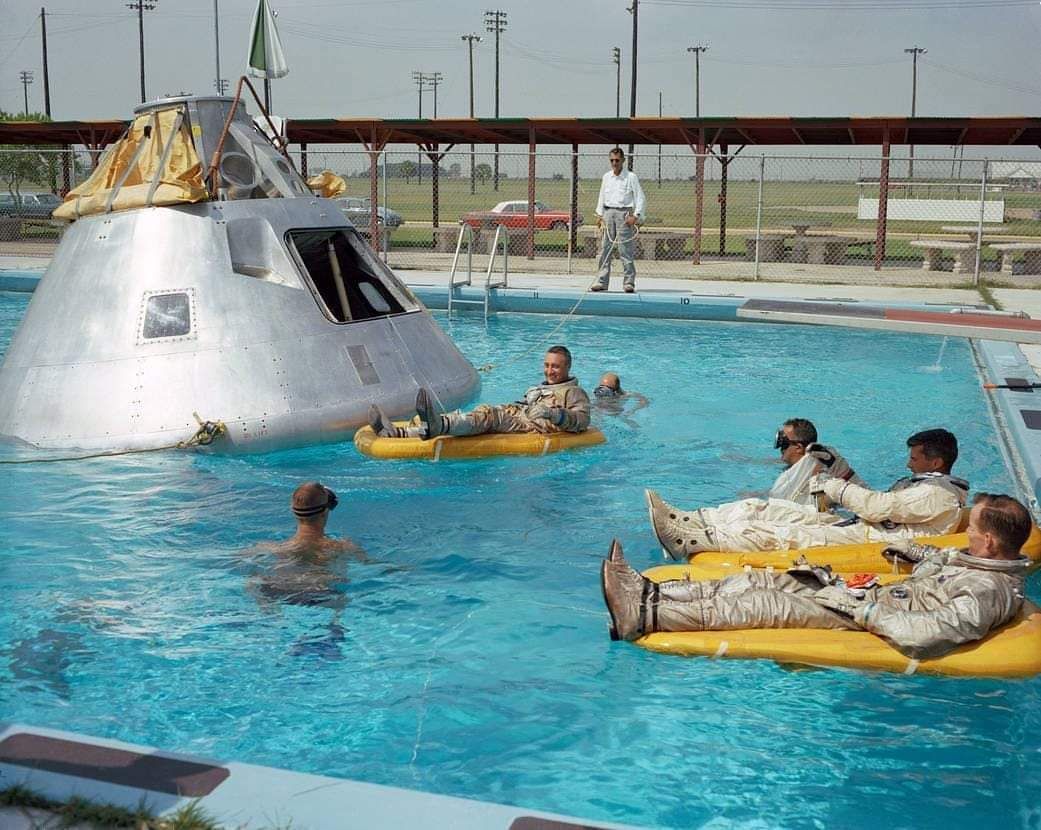 NASA actors rest after filming the final splash down scene for the moon landings.