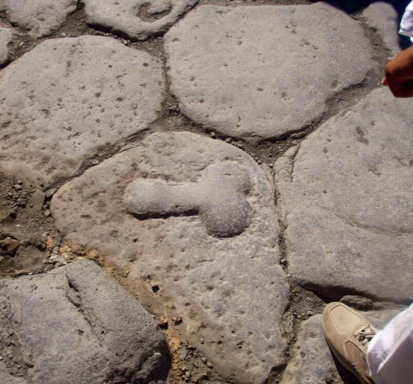 In Pompeii, phallic symbols on local roadways pointed the way to the nearest brothel; possibly to direct foreign sailors who didn't speak Latin.