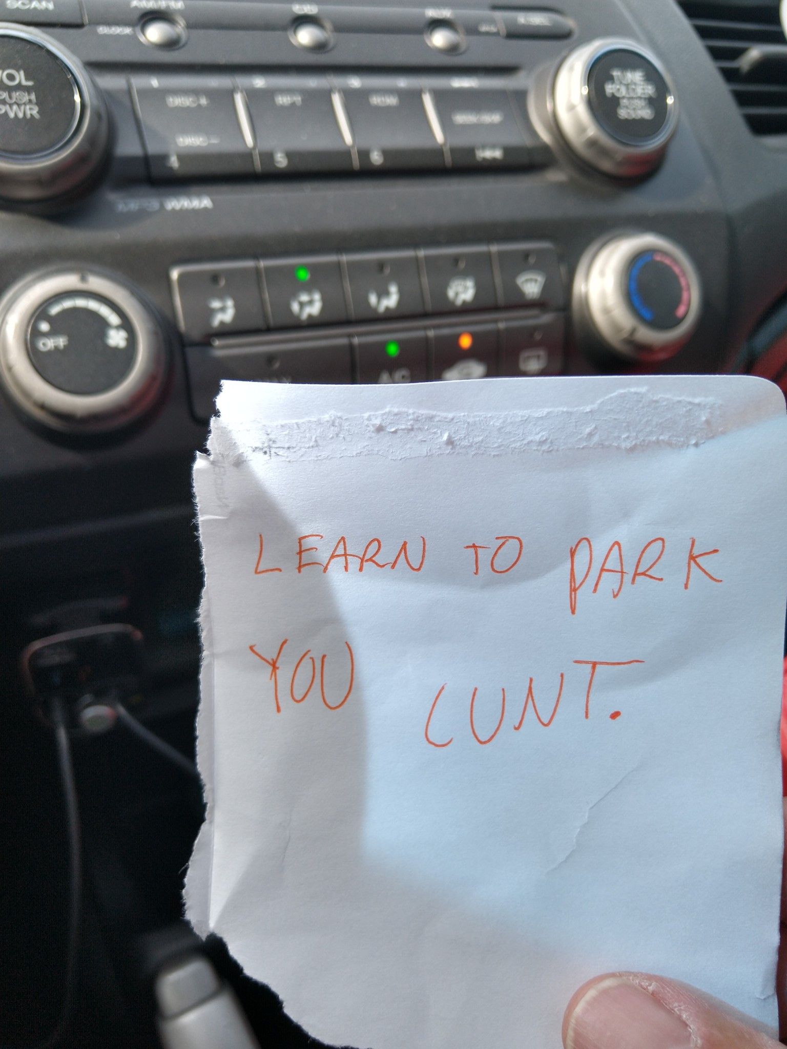 A pissed off old lady put this under my wiper yesterday. God bless her.
