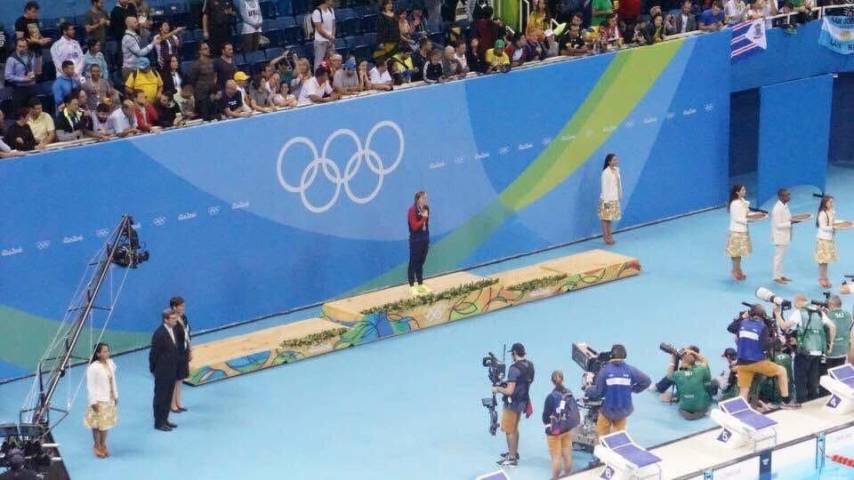 Katie Ledecky at her medal ceremony . . . waiting for her opponents to finish the race.