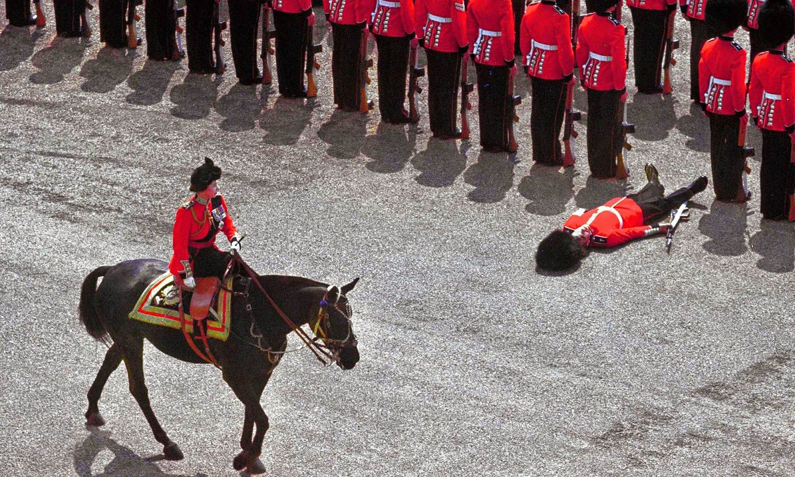 Queen Elizabeth II personally executes a soldier for "not standing precisely in line and being an unpleasant sight".