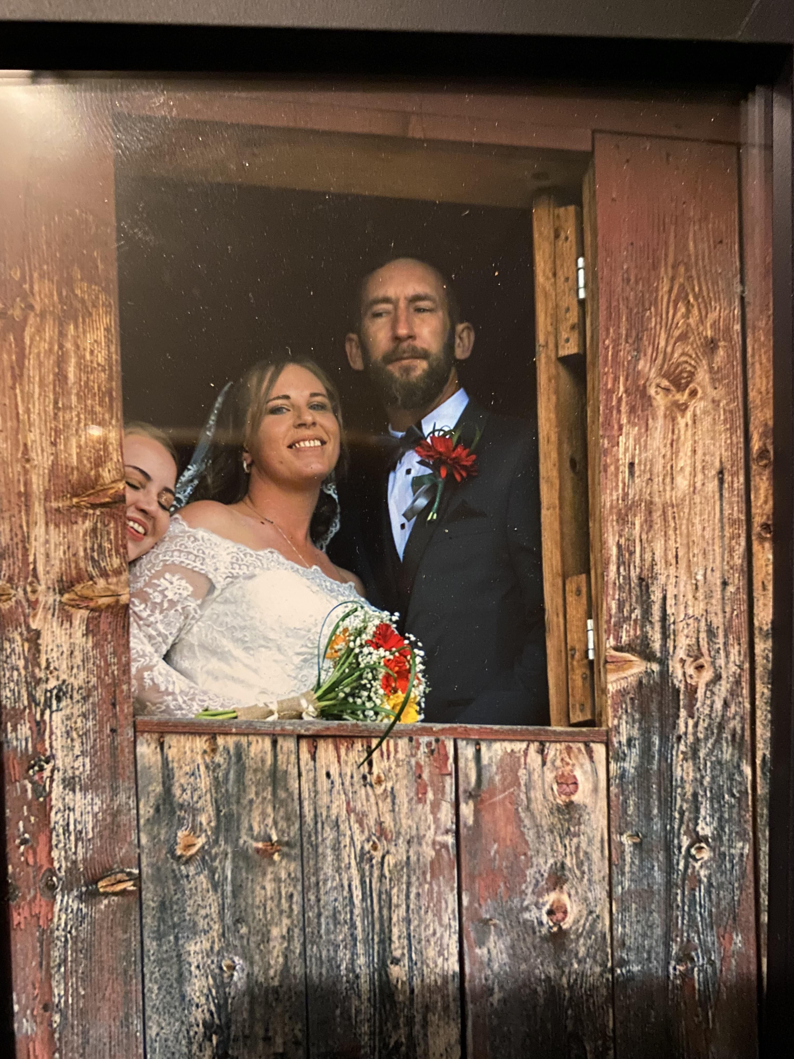 My friends got married. Did NOT know they were taking a photo in the window and photobombed the pic.