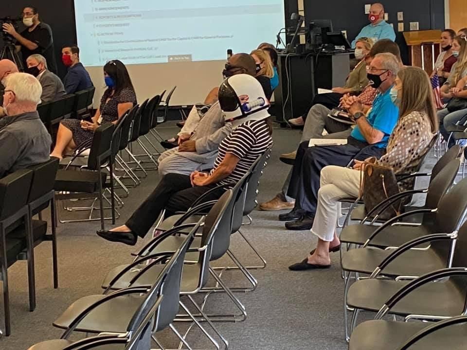 Woman at local anti-mask meeting wore a space helmet