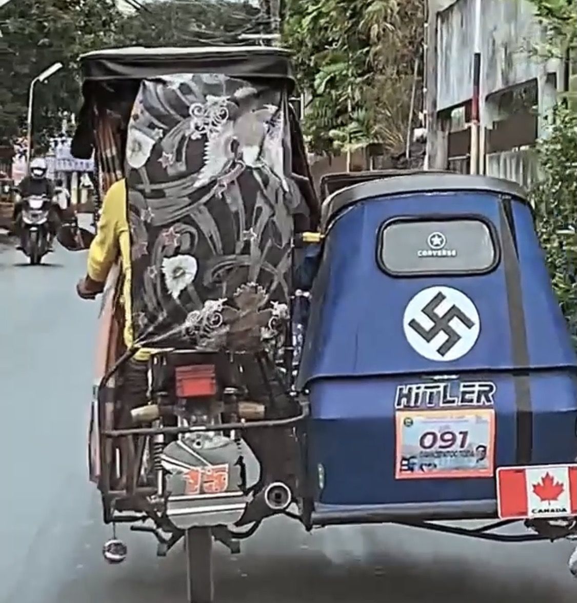 A vehicle of the Canadian National Socialist Unity Party roaming around the streets of Quebec