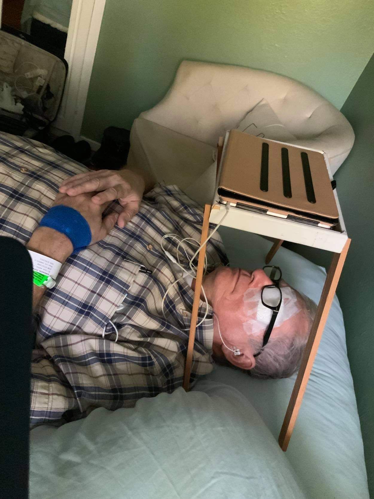 My dad's "homemade iPad holder" for after his eye surgery