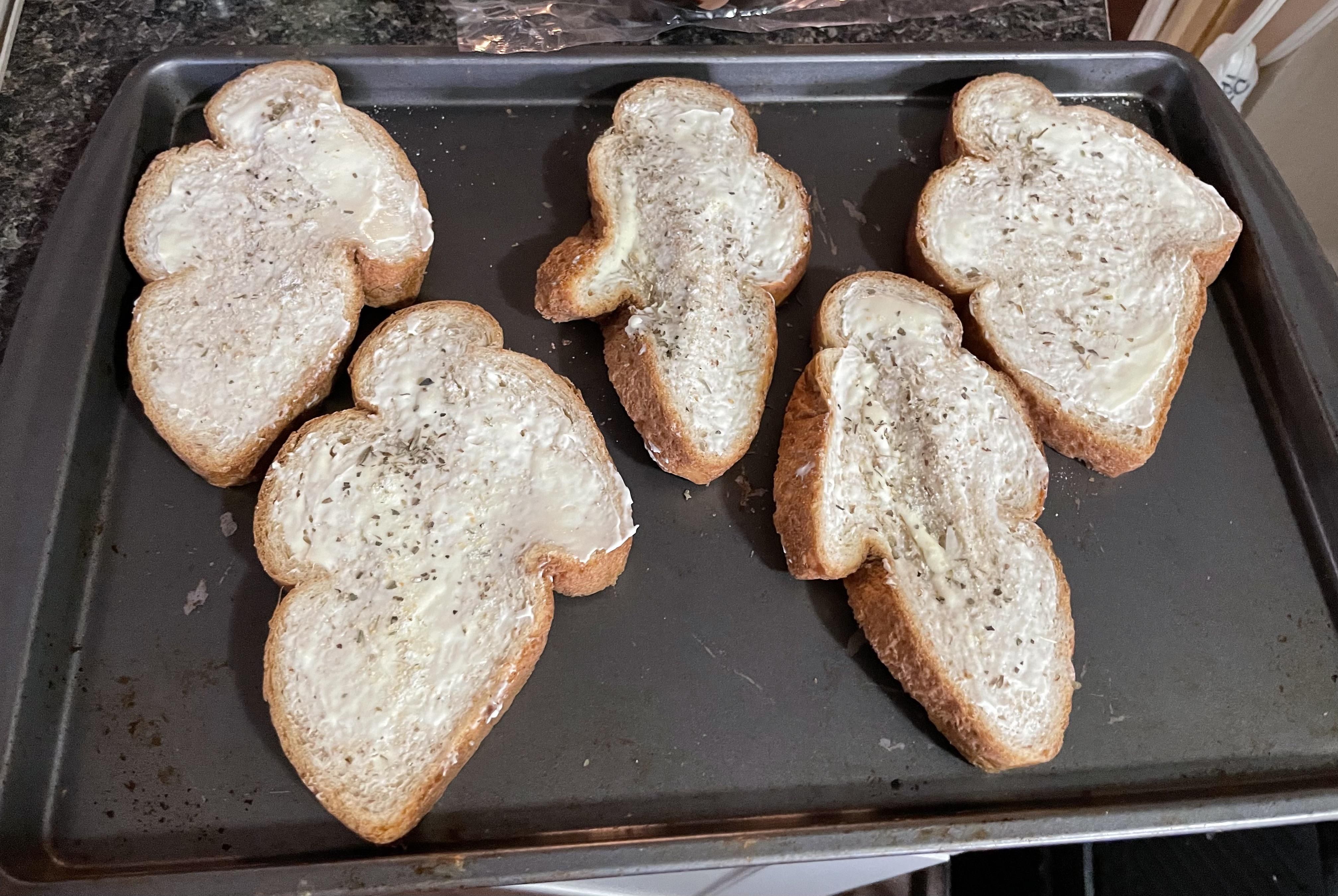 Bread got squished on the way home from the store. Now we are having Garlic Ghosts :)
