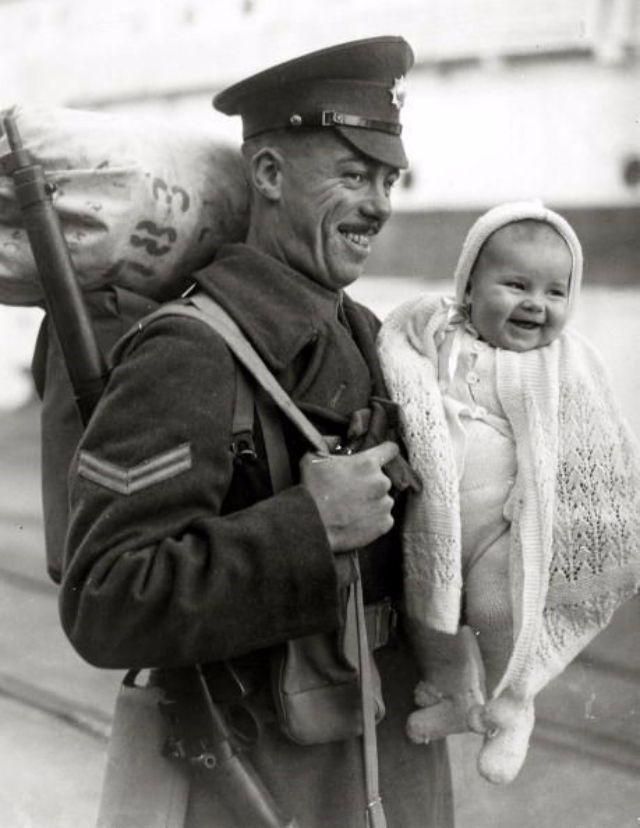 A British soldier returning home with the spoils of war , a bag full of silverware and some random baby to be sold to the Welsh mines , 1945