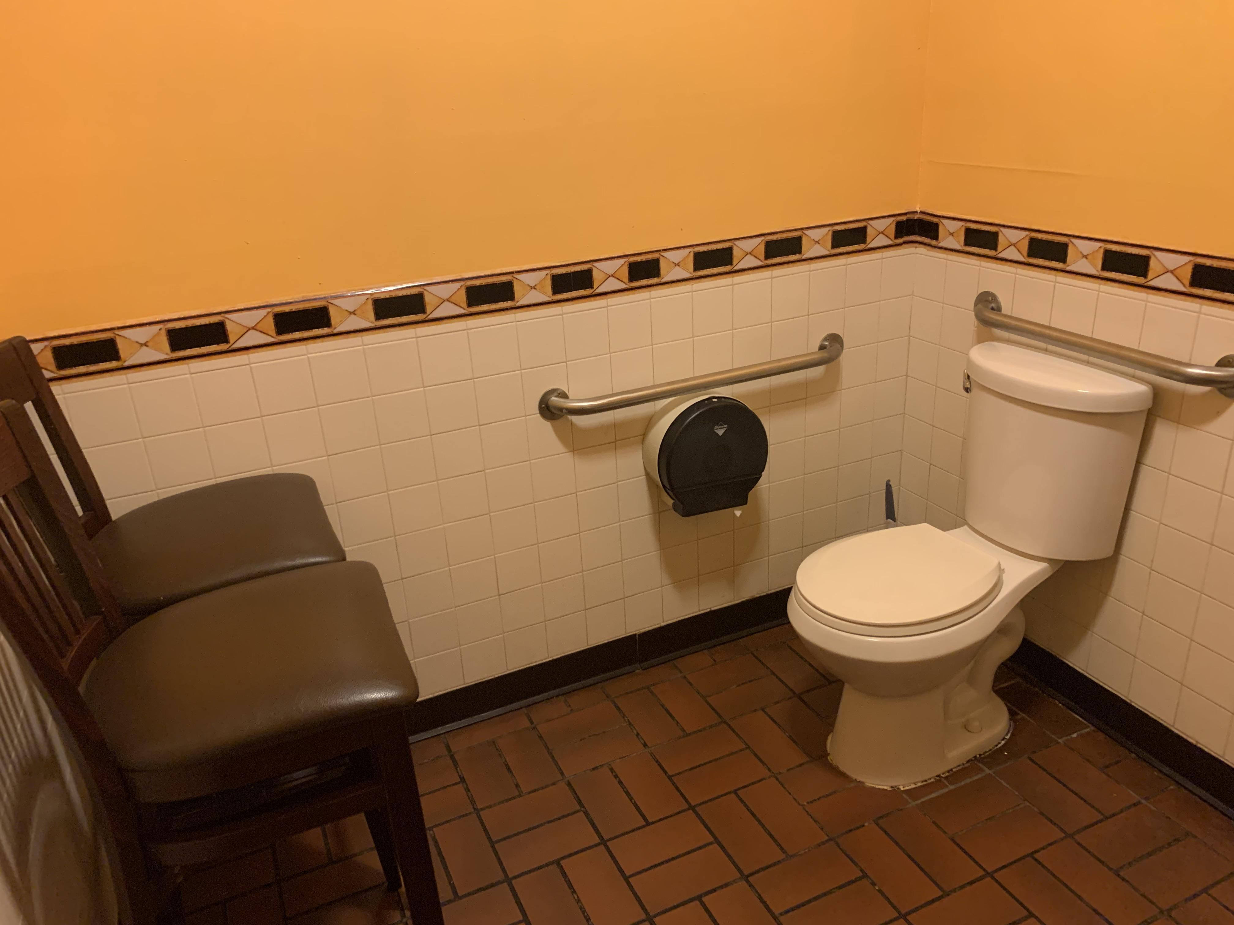 Not sure why this Chinese restaurant has chairs in front of the toilet but my interest is now peaked.
