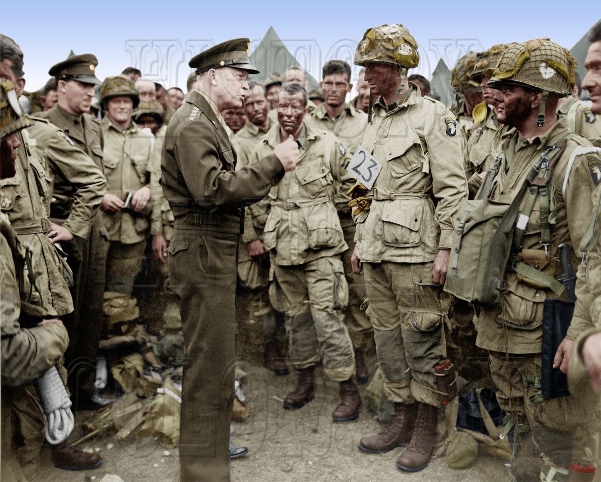 Dwight D Eisenhower scolding several Airborne Rangers for wearing blackface on Halloween eve , June 1944.