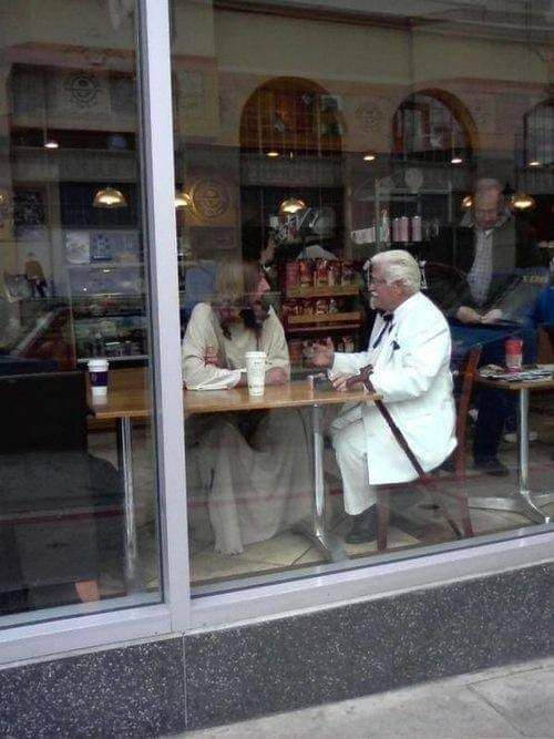 Jesus Christ and Colonel Sanders discussing which spices should be used to create the all famous original recipe chicken.