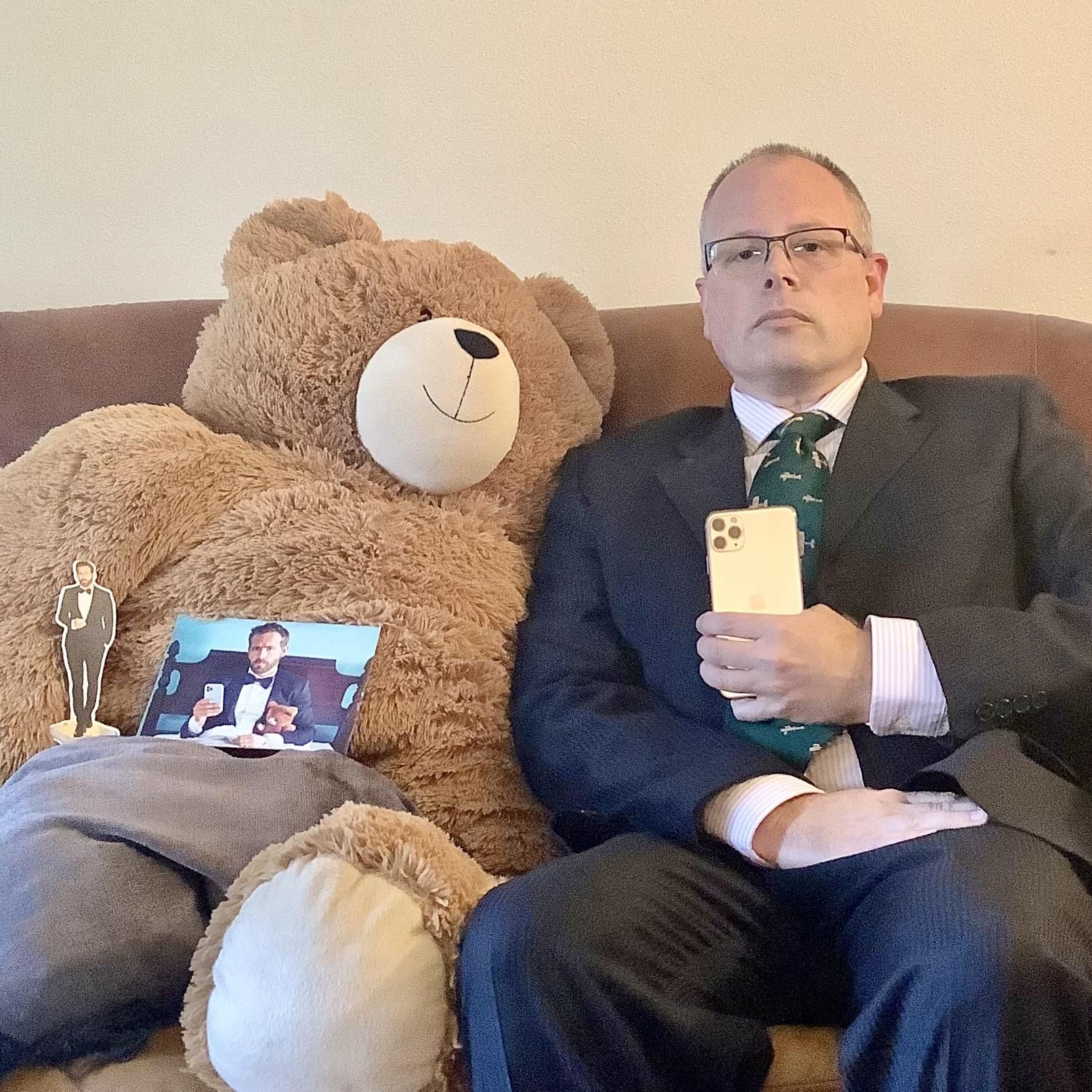Dear Ryan, I got your Christmas card. Here’s me with my teddy bear and phone. Thanks for owning my phone company.
