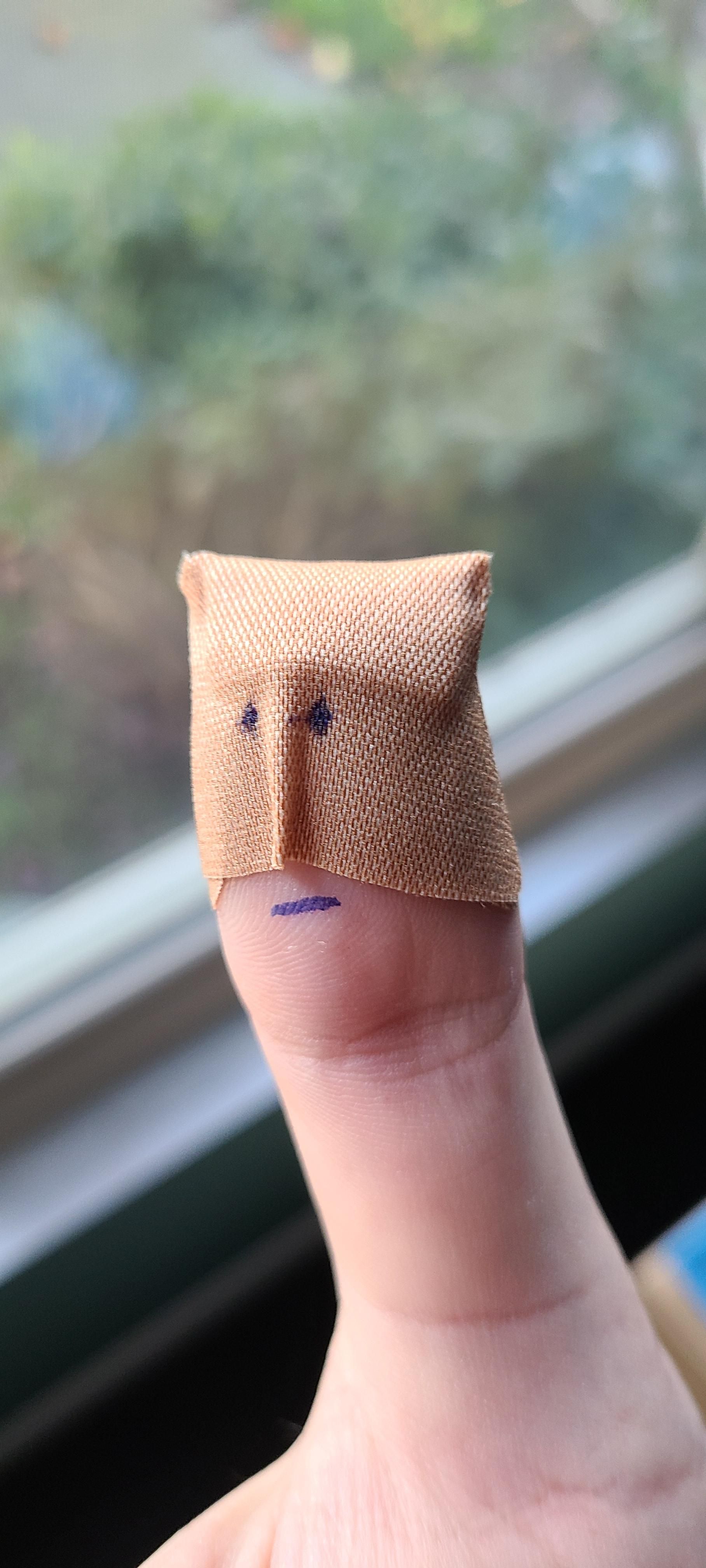 Sliced my finger open. Realized after putting on the bandaid that it looked like a lame superhero.