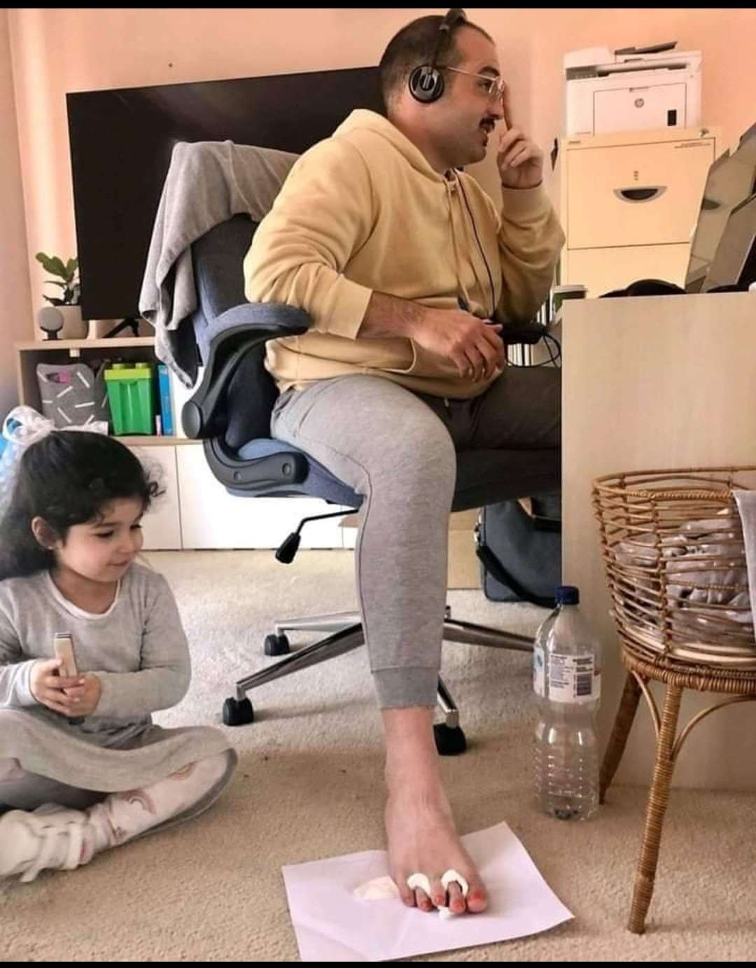 He let his daughter paint his toenails so he can finish the zoom meeting in peace.