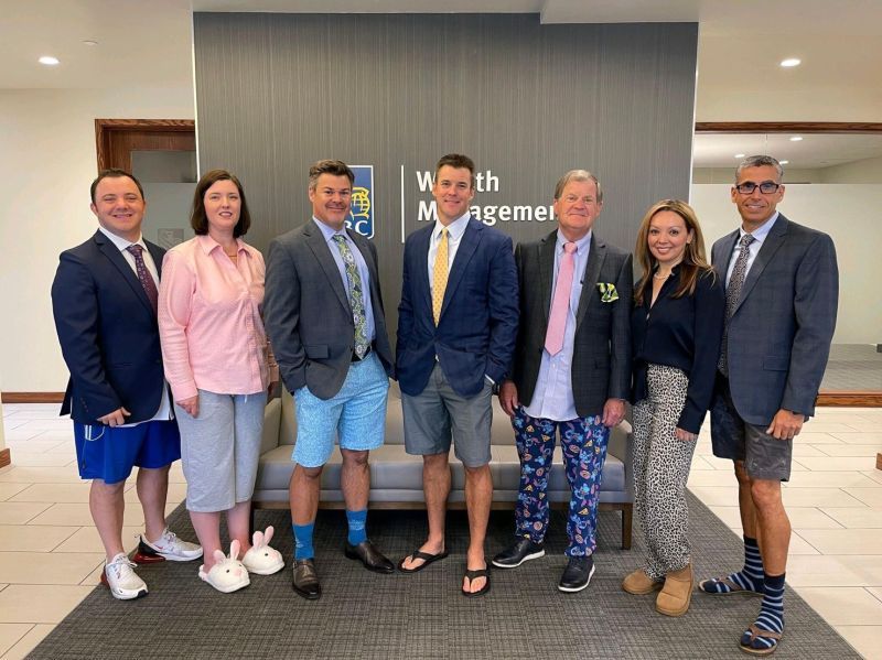 A group of managers at RBC decided to take a picture in the outfits they use for zoom meetings