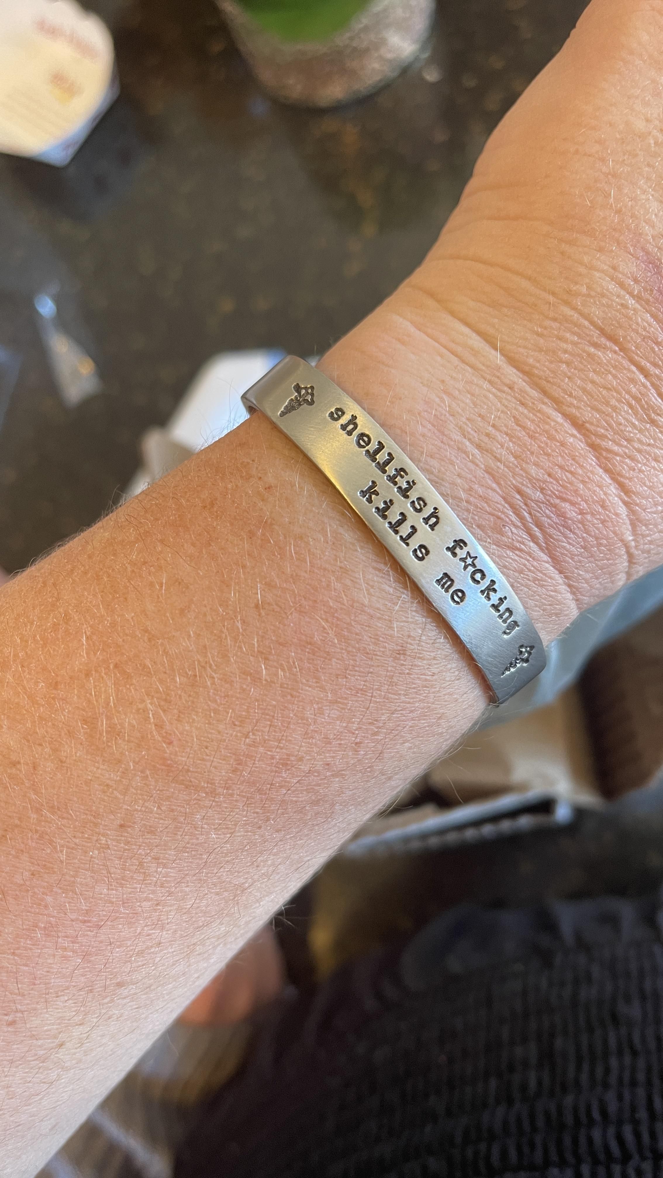 I developed an anaphylactic shellfish allergy last month at age 41. I’m pretty pissed about it, but my medical alert bracelet makes me smile.