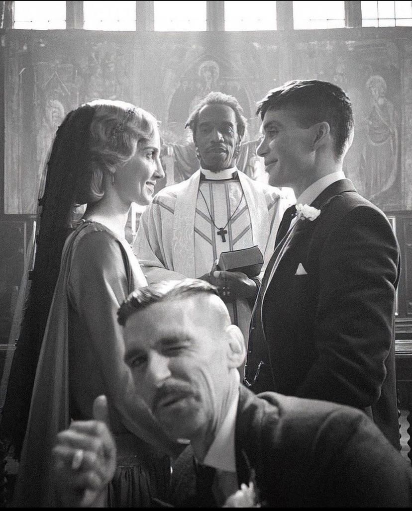 My great uncle photobombing my grandparents getting married during prohibition by a black priest in the South