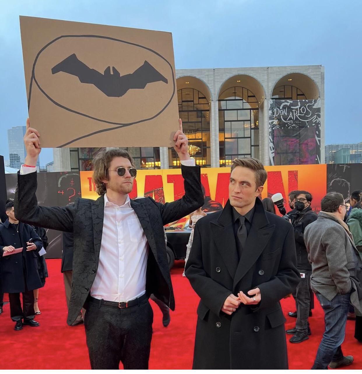 Dude with sign at Batman premiere
