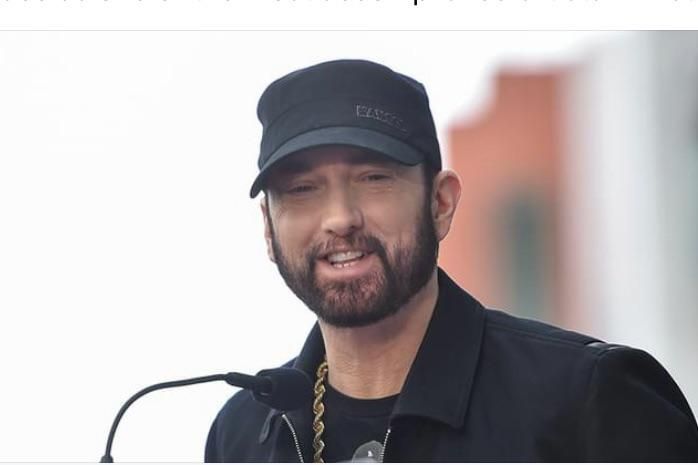 For years I thought Eminem looked like a moron for never smiling. I stand corrected.