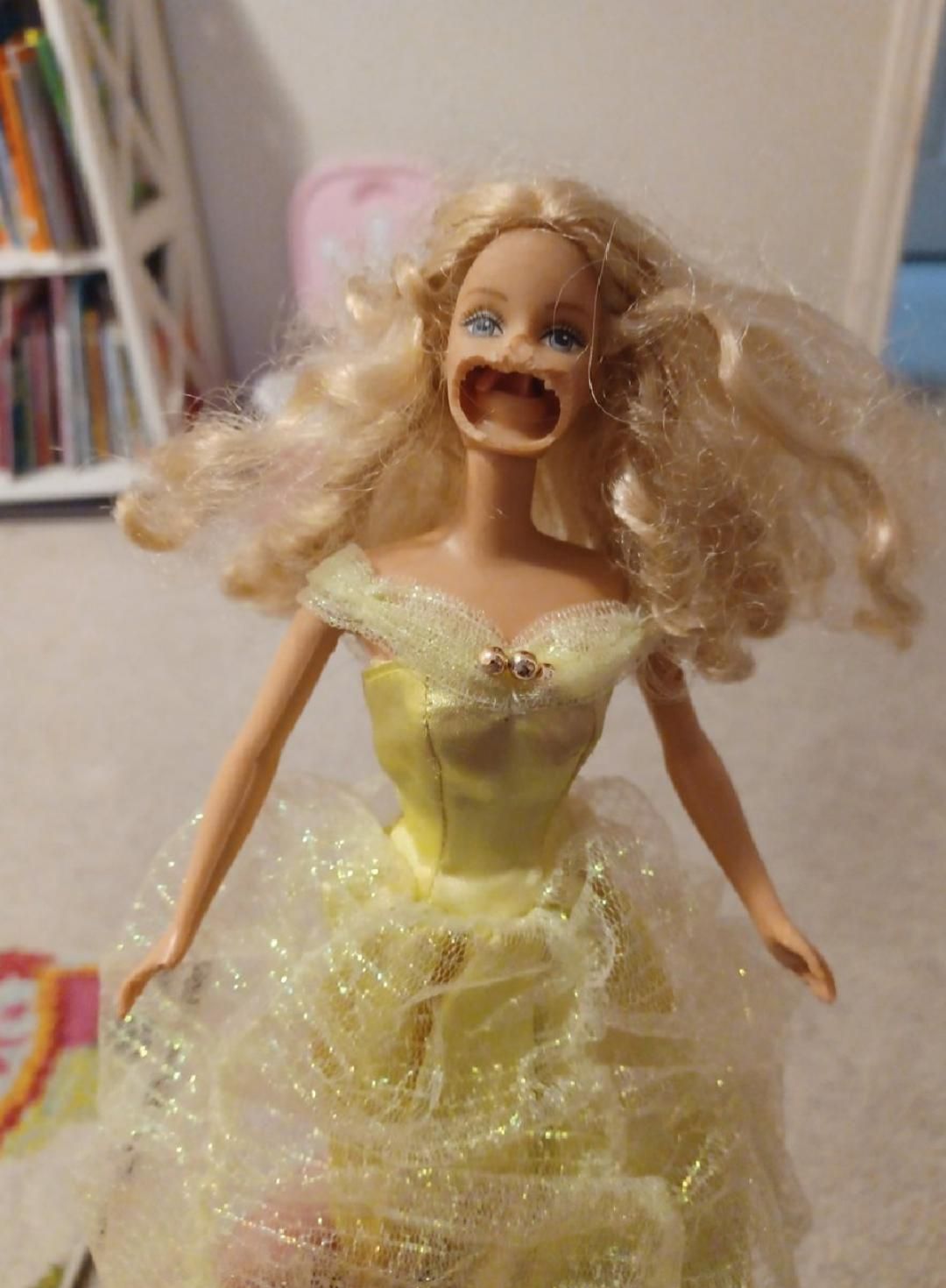 dog chewed on daughter's old Barbies and created....