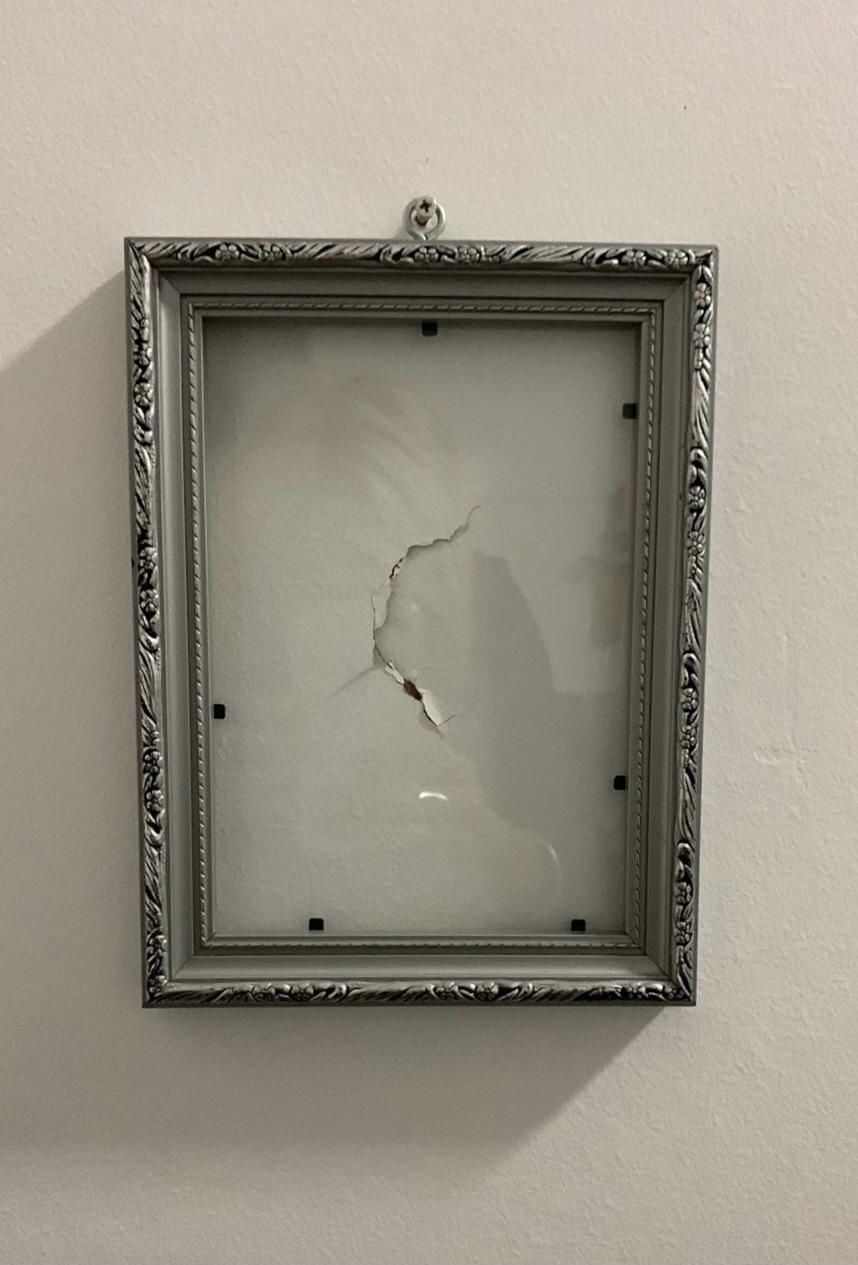 My brother punched a hole in the wall so my mum framed it.
