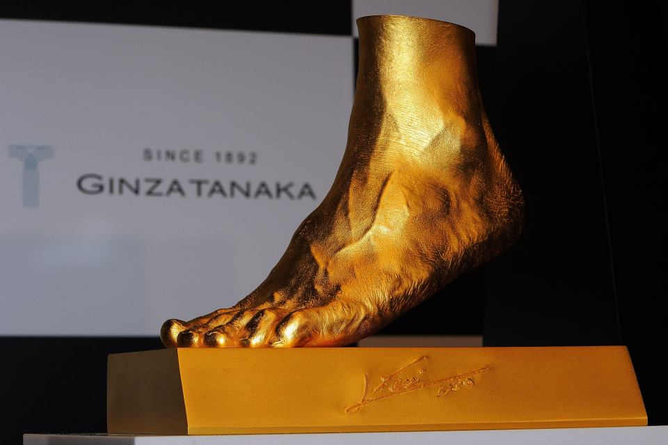 55 pound gold replica of Messi's foot
