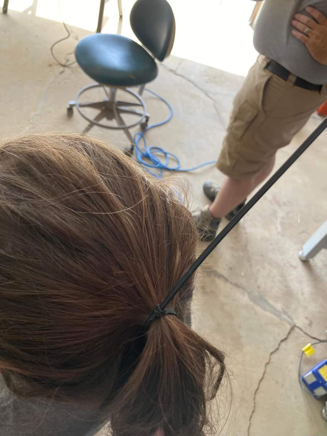 Daughter wants to work in the garage with dad. needs hair pulled back. Dad hack 101.
