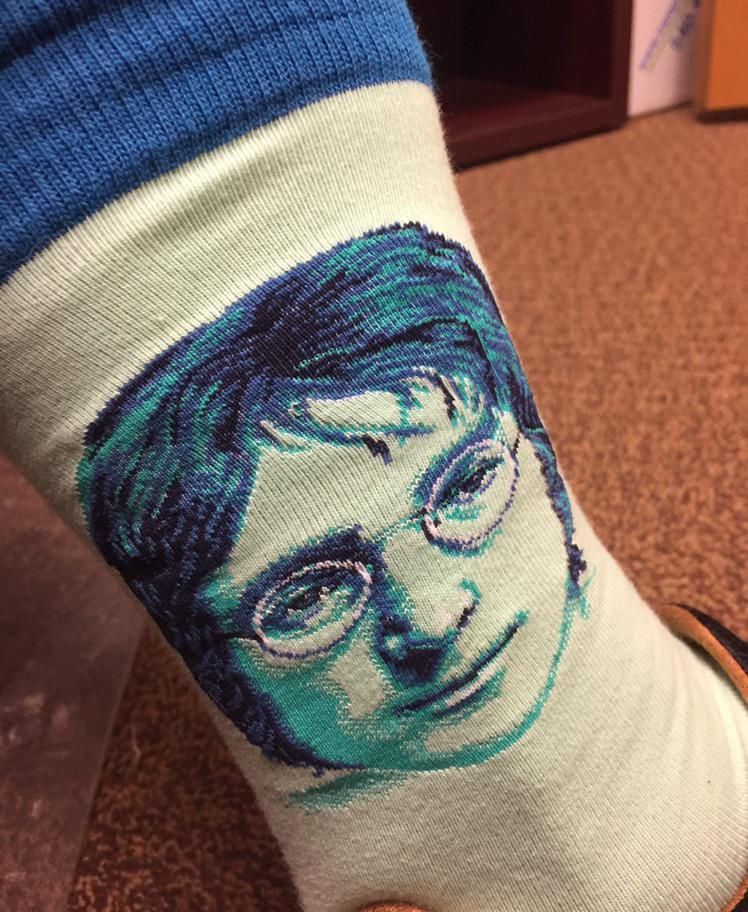 You decide: are these socks supposed to be John Lennon, or Harry Potter?