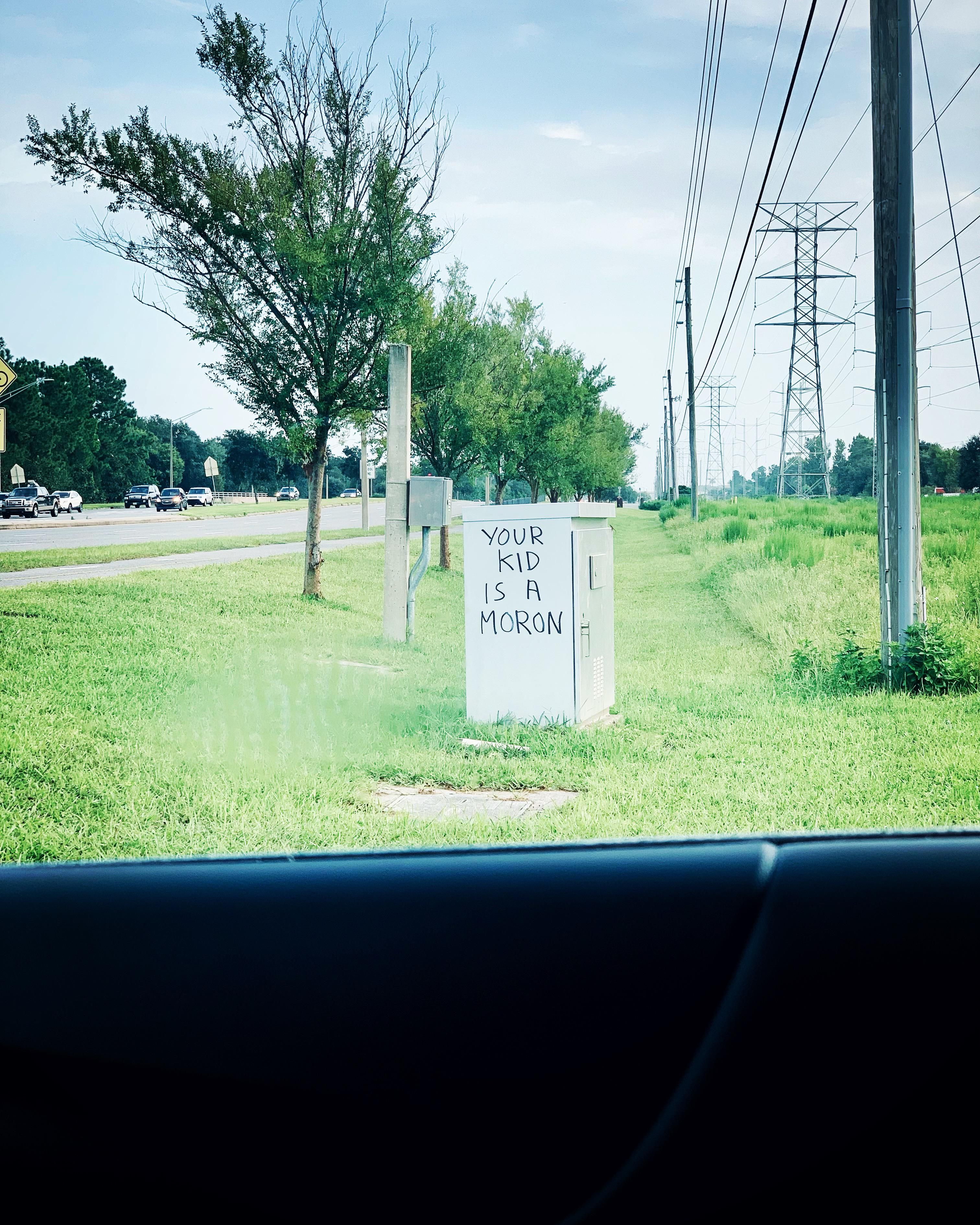 Dropped my kid off at school and got stuck at the red light on the way out. I looked over and…