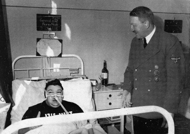 Famous austrian painter Adolf H visits his fan at a hospital 1936