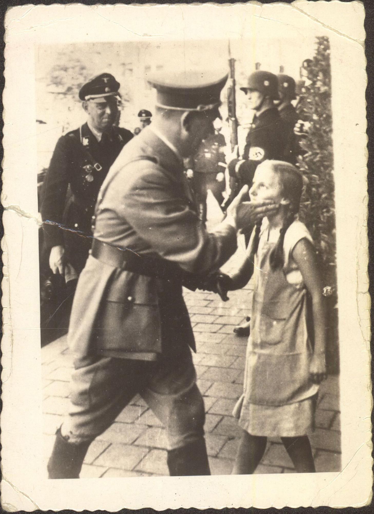 Adolf Hitler slaps a child for losing World War II