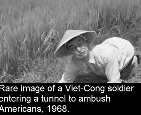 A Viet-Cong soldier entering a tunnel to ambush Americans, 1968