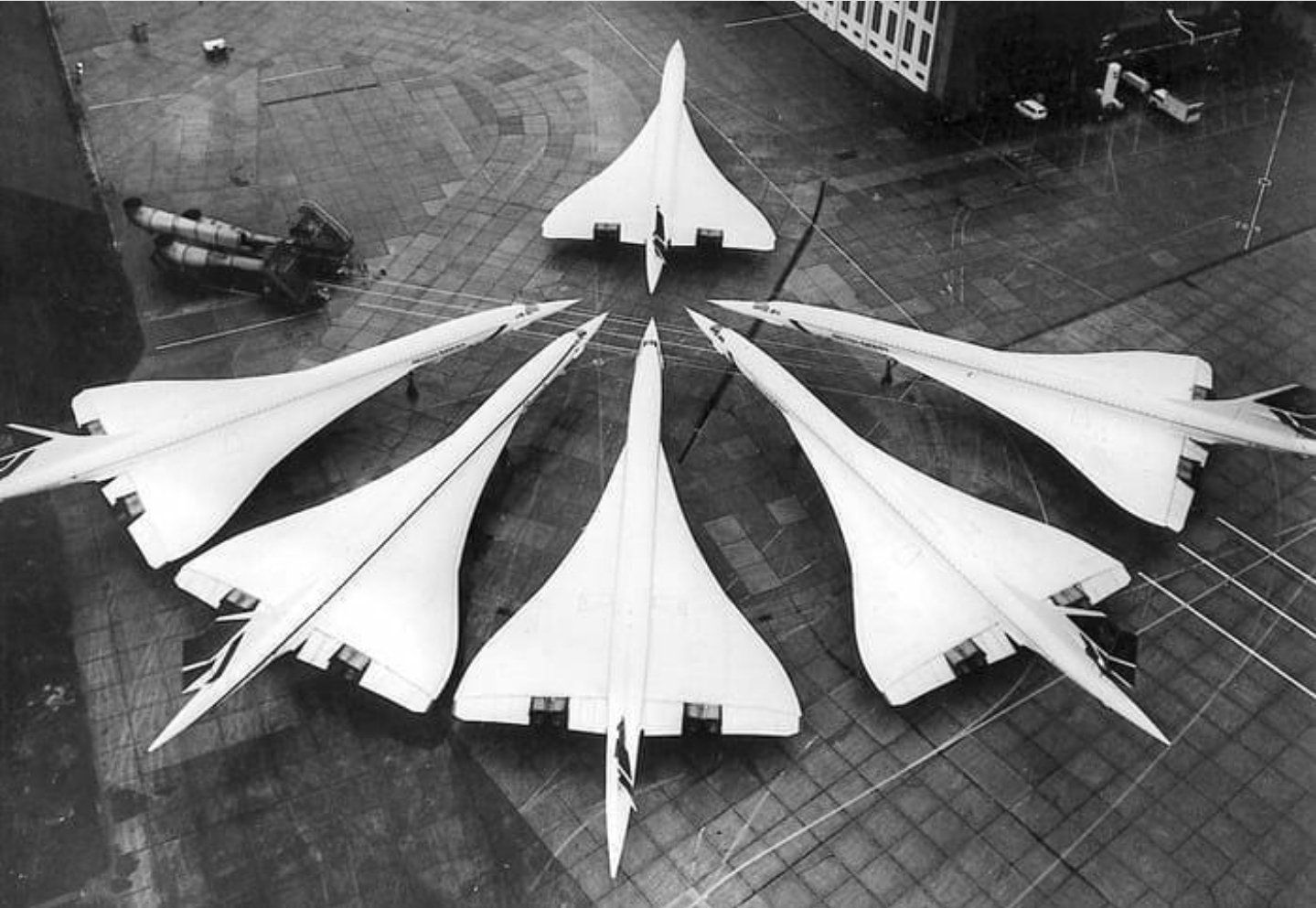 British Airways Concordes gathering to sniff the back of a freshly built one before deciding if they let it into their group. If rejected, it has to go to Air France, 1986