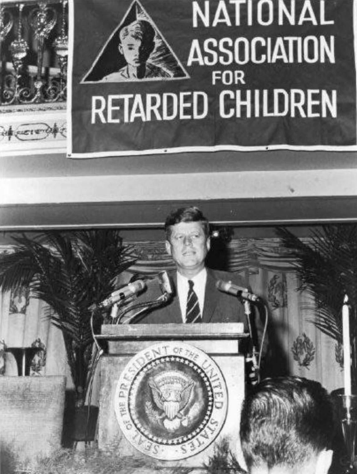 John F. Kennedy gives a speech at the first Flat Earth Convention, 1963