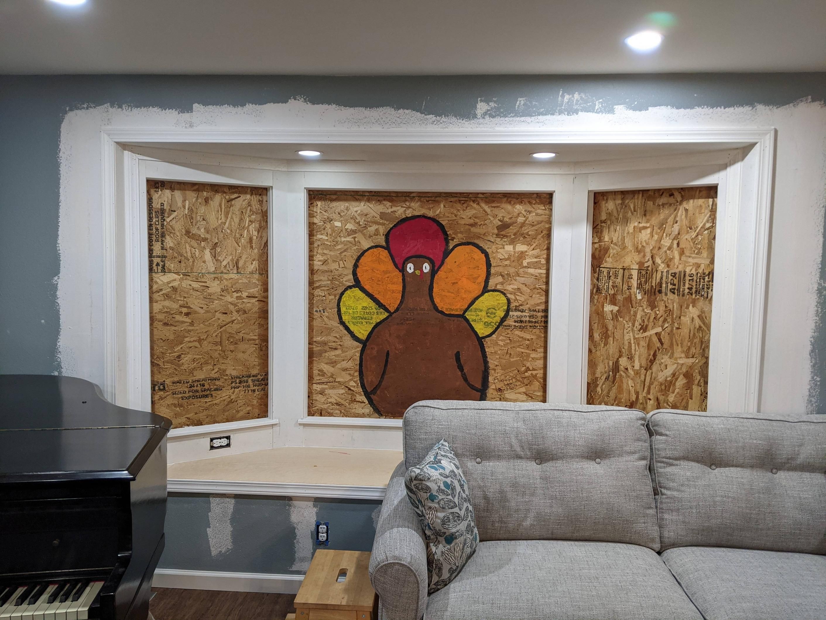 A remodel project did not get completed in time for Thanksgiving, so my daughter painted a turkey on the plywood
