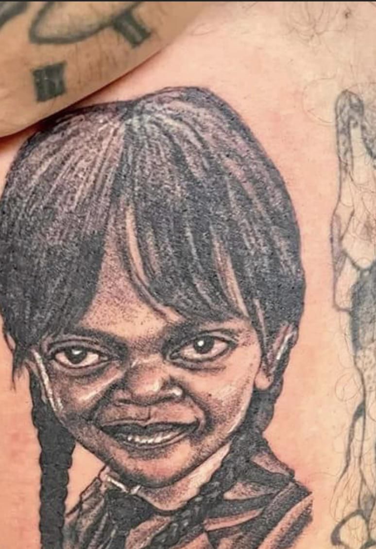 Guy got Wednesday tatted on him. Looks more like Samuel L. Jackson’s daughter.