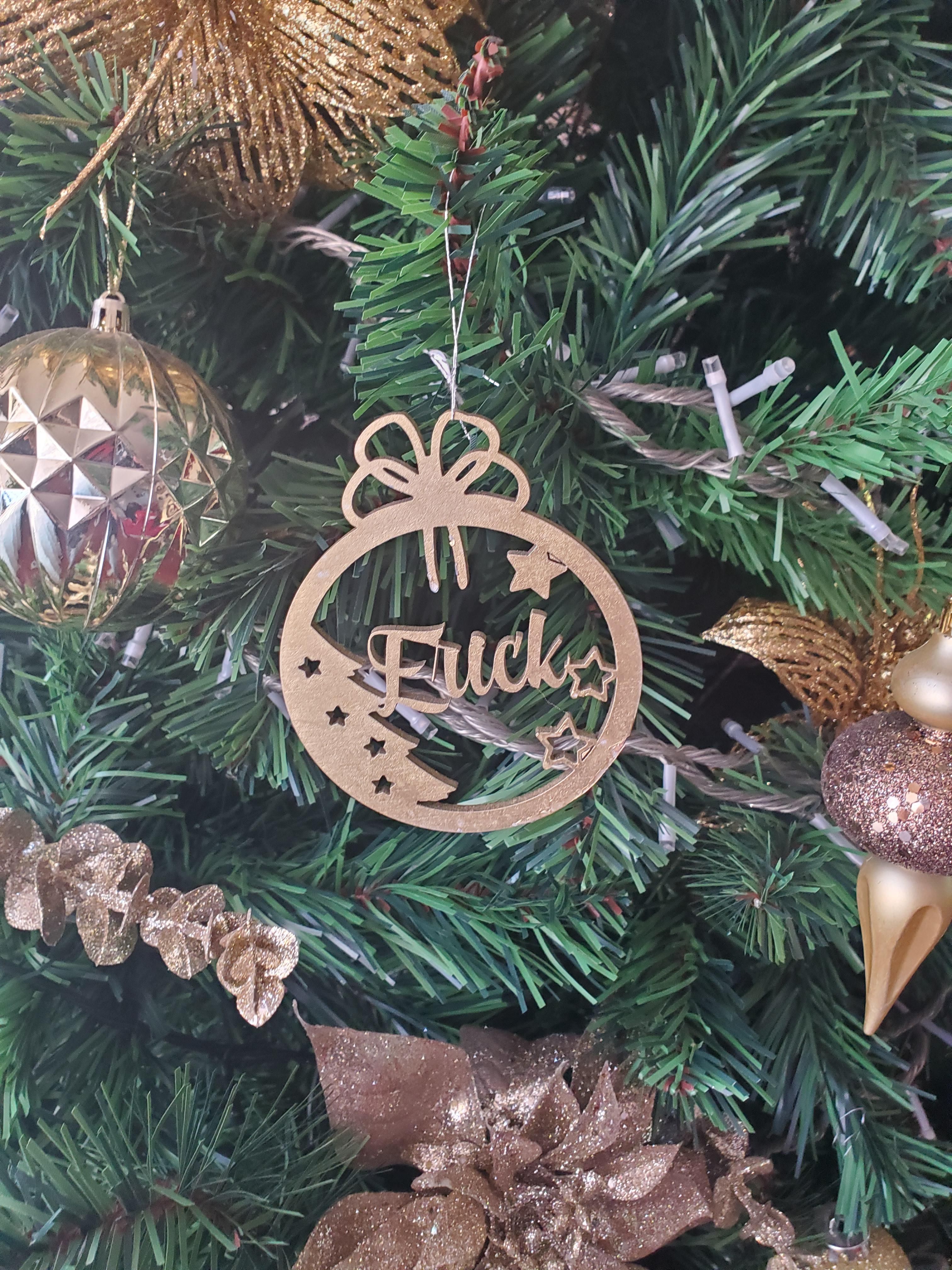 My MIL had wooden laser cut ornaments made for each of her children and grandchildren this year. The ornament for Erick didn't turn out as planned.