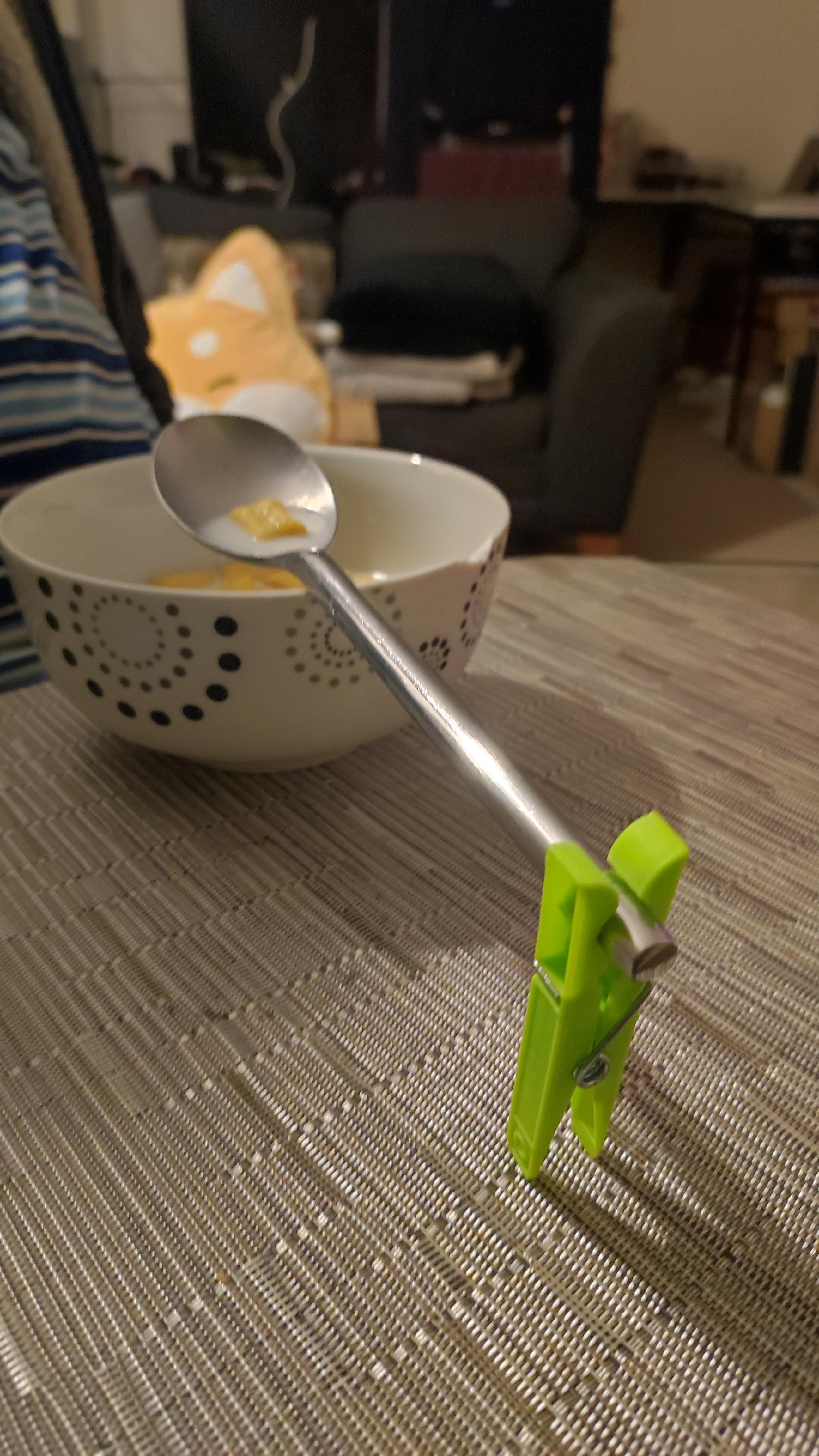 My bf solution to hold the spoon while he eats cereals